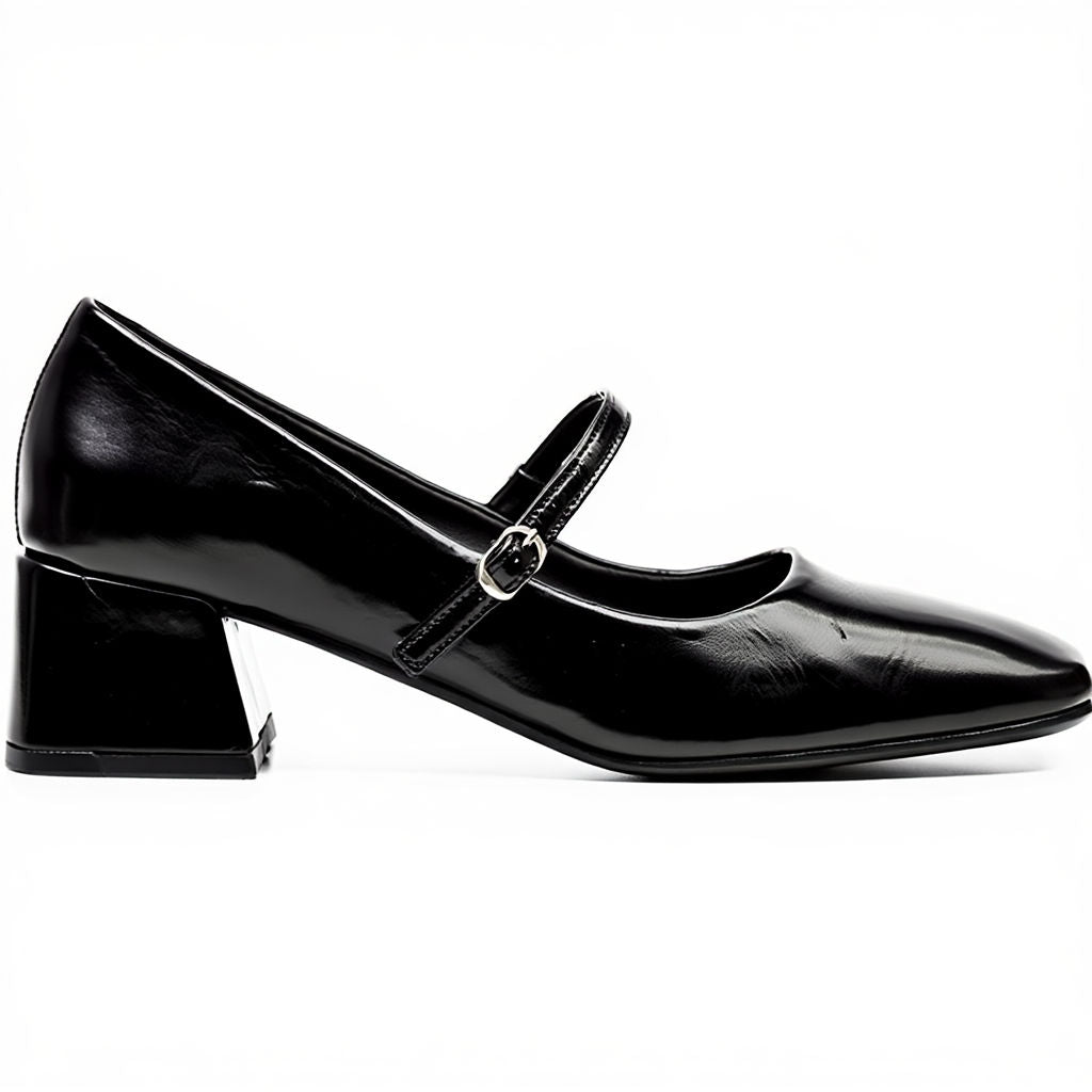 Black patent leather shoe with a strap on a white background