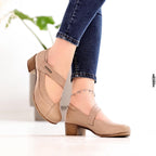 Beige shoes worn with blue jeans on a light background, featuring the 'B Beautiful Comfort' brand.