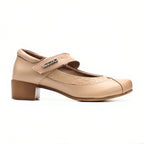 Beige shoe with a strap on a white background