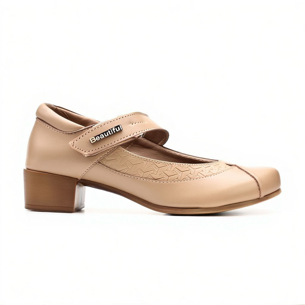 Beige shoe with a strap on a white background