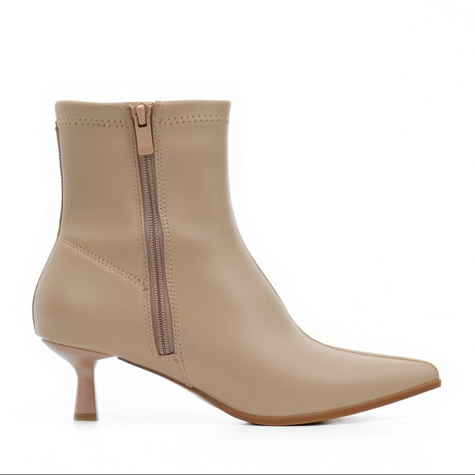 Beige ankle boot with a zipper on a white background
