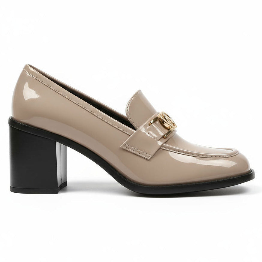 Beige patent leather shoe with a black block heel on a white background