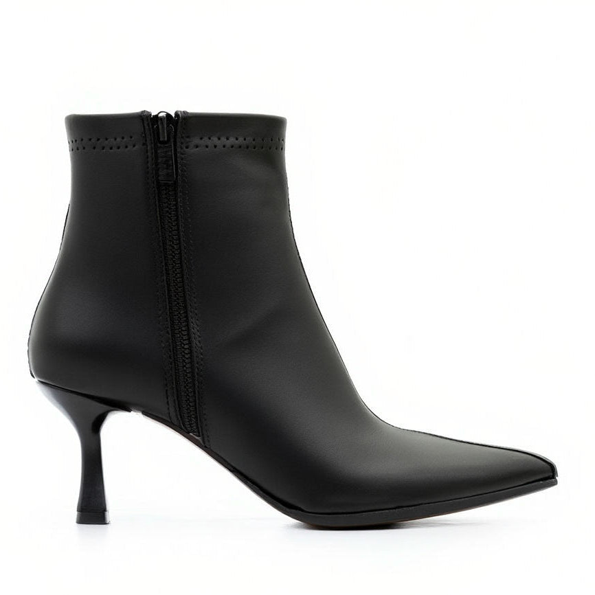 Black leather ankle boot with a thin heel on a white background