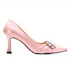 Pink high-heeled shoe with a buckle on a white background