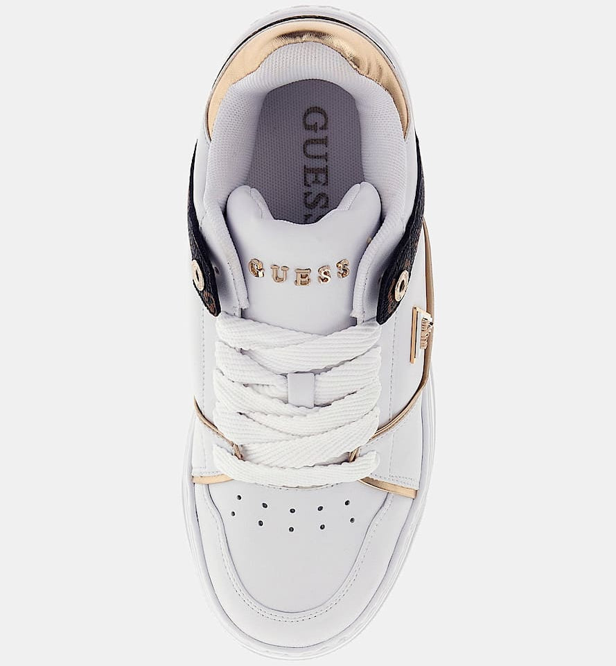White sneaker with gold accents and 'Guess' branding on a white background