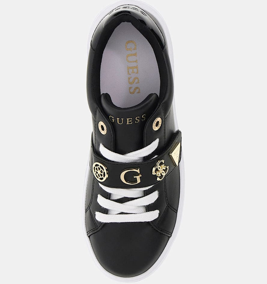 Black sneaker with white laces and gold accents on a white background