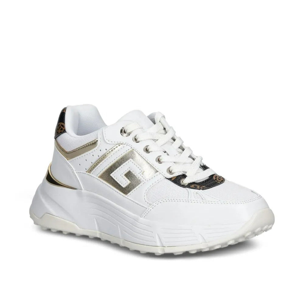 White sneaker with gold accents on a white background