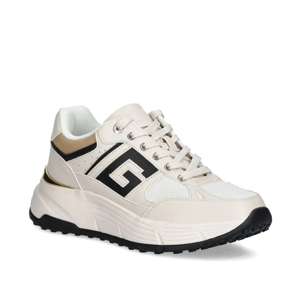 White sneaker with black logo on a white background