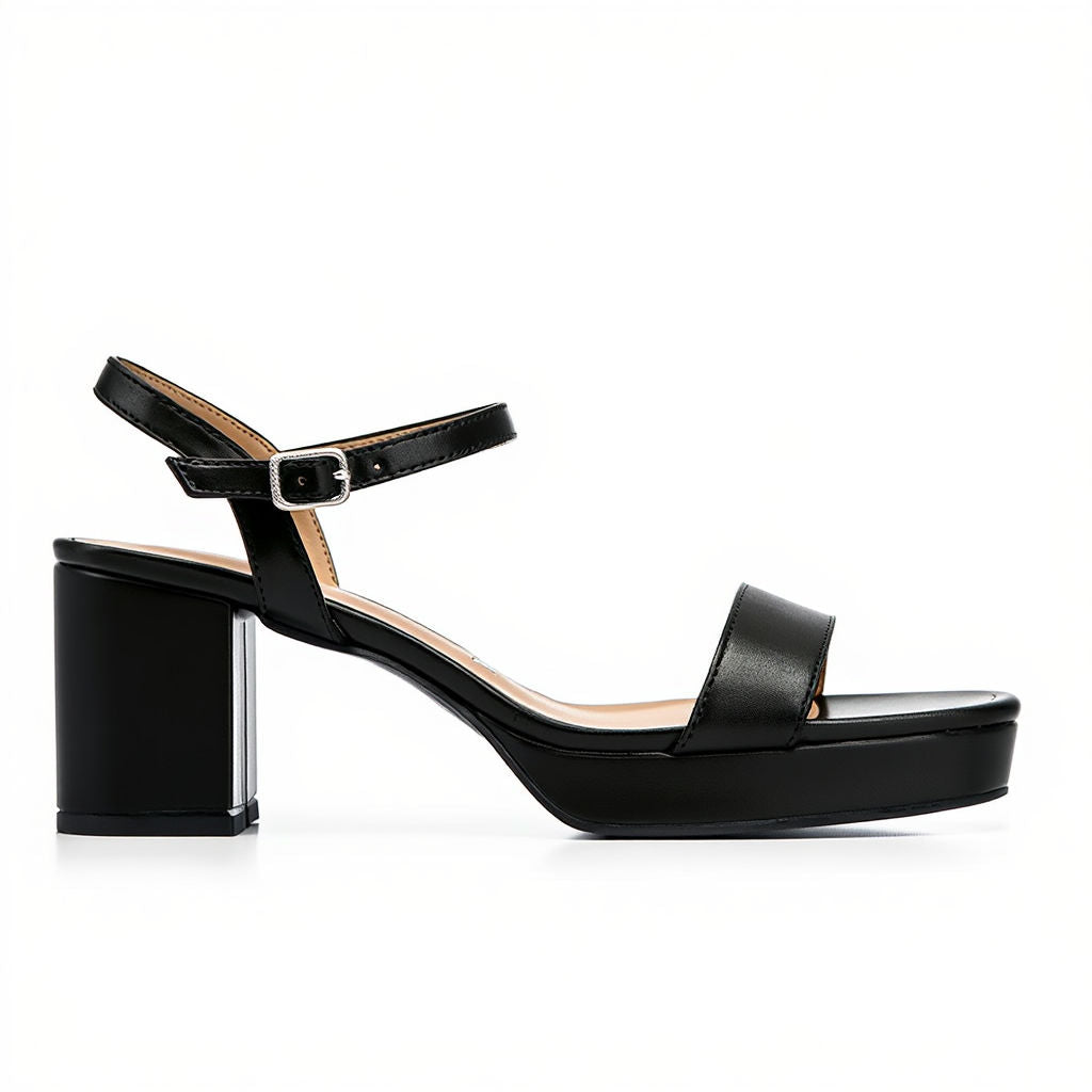 Black sandal with a block heel on a white background