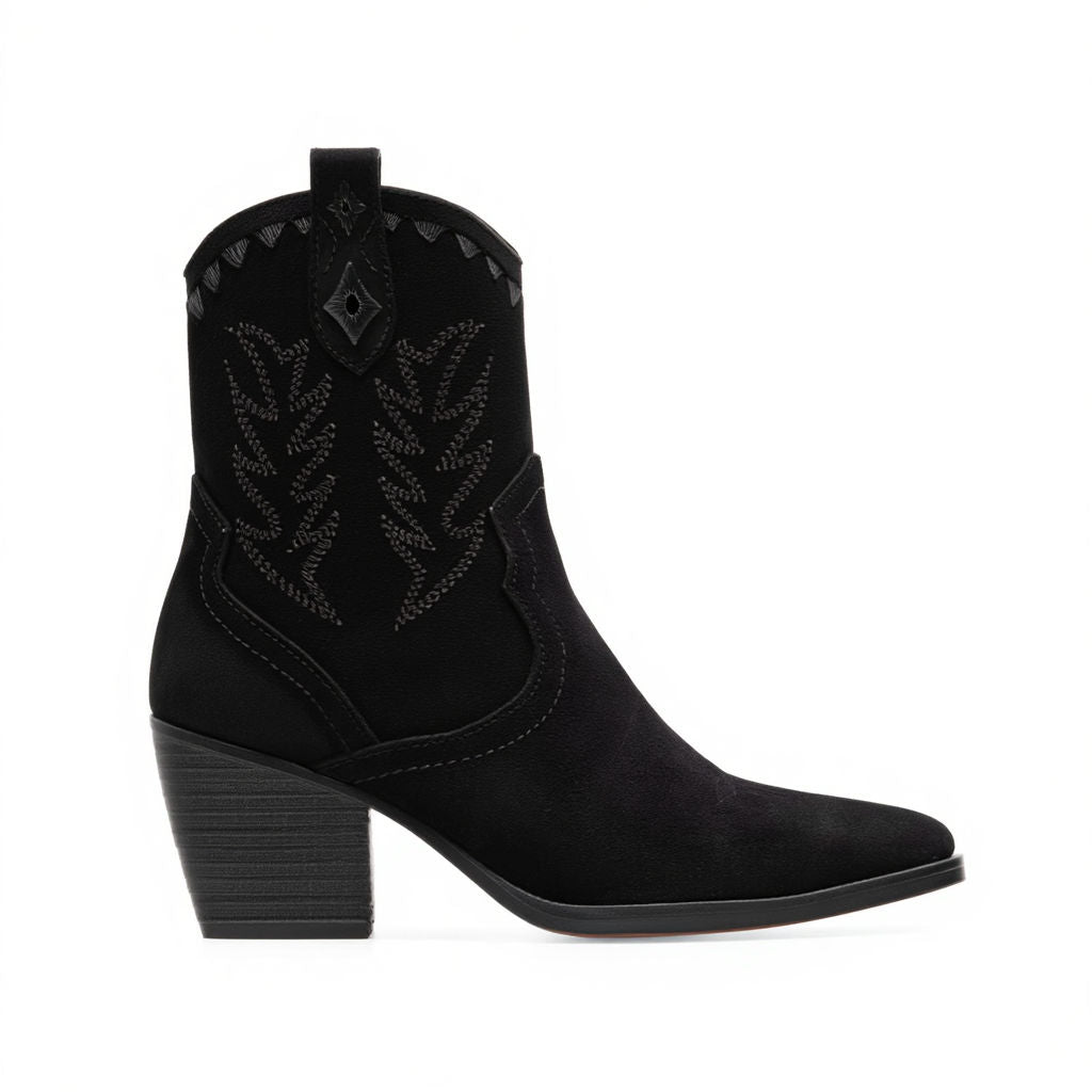Black cowboy boot with decorative pattern on a white background