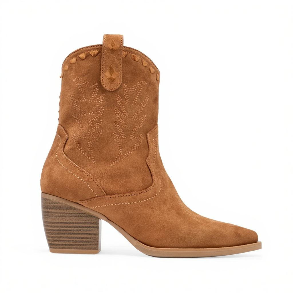 Tan cowboy boot with decorative stitching on a white background