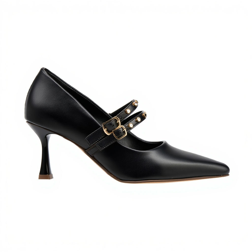 Black high-heeled shoe with gold buckles on a white background