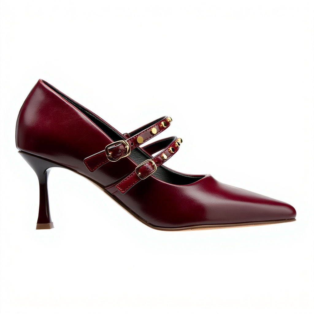Burgundy high-heeled shoes with gold strap on a white background