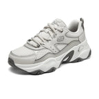 Angled front view of Skechers D'Lites 5.0 Team Neutral women’s sneakers with thick outsole and lace-up design.