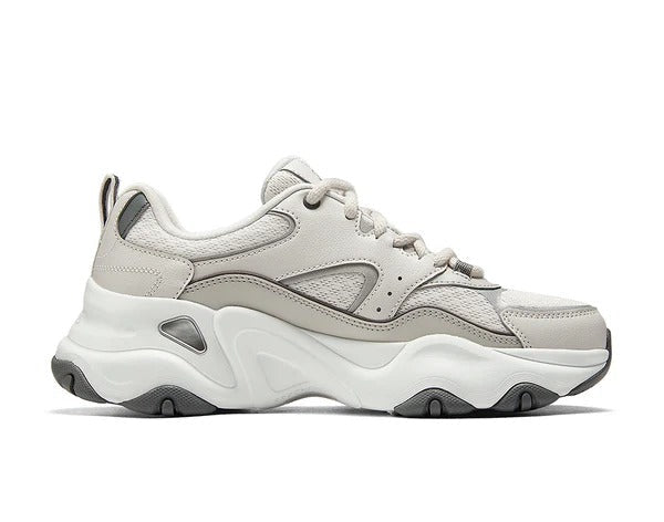 Inner side view of Skechers D'Lites 5.0 Team Neutral sneakers showing layered sole and panel detailing.