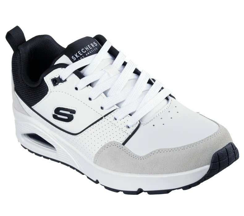 Angled view of Skechers UNO Retro One men’s white-black sneakers showing leather and suede mix.