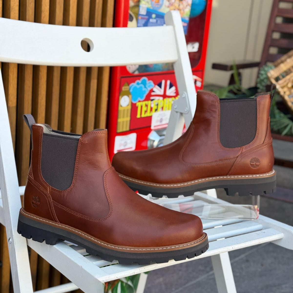 Timberland Britton Road Mid Chelsea brown men’s leather boots outdoor on white chair background