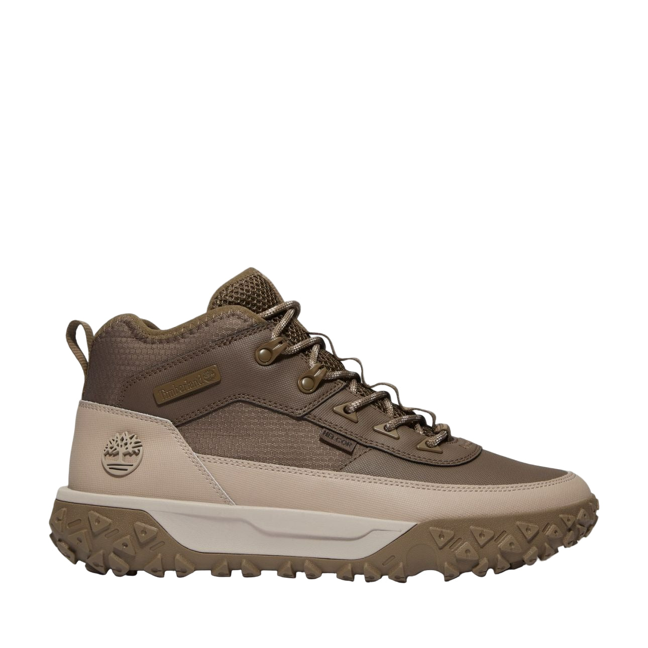 Side view of Timberland GS Motion beige men’s outdoor sneakers showing Timberland logo and GreenStride midsole.