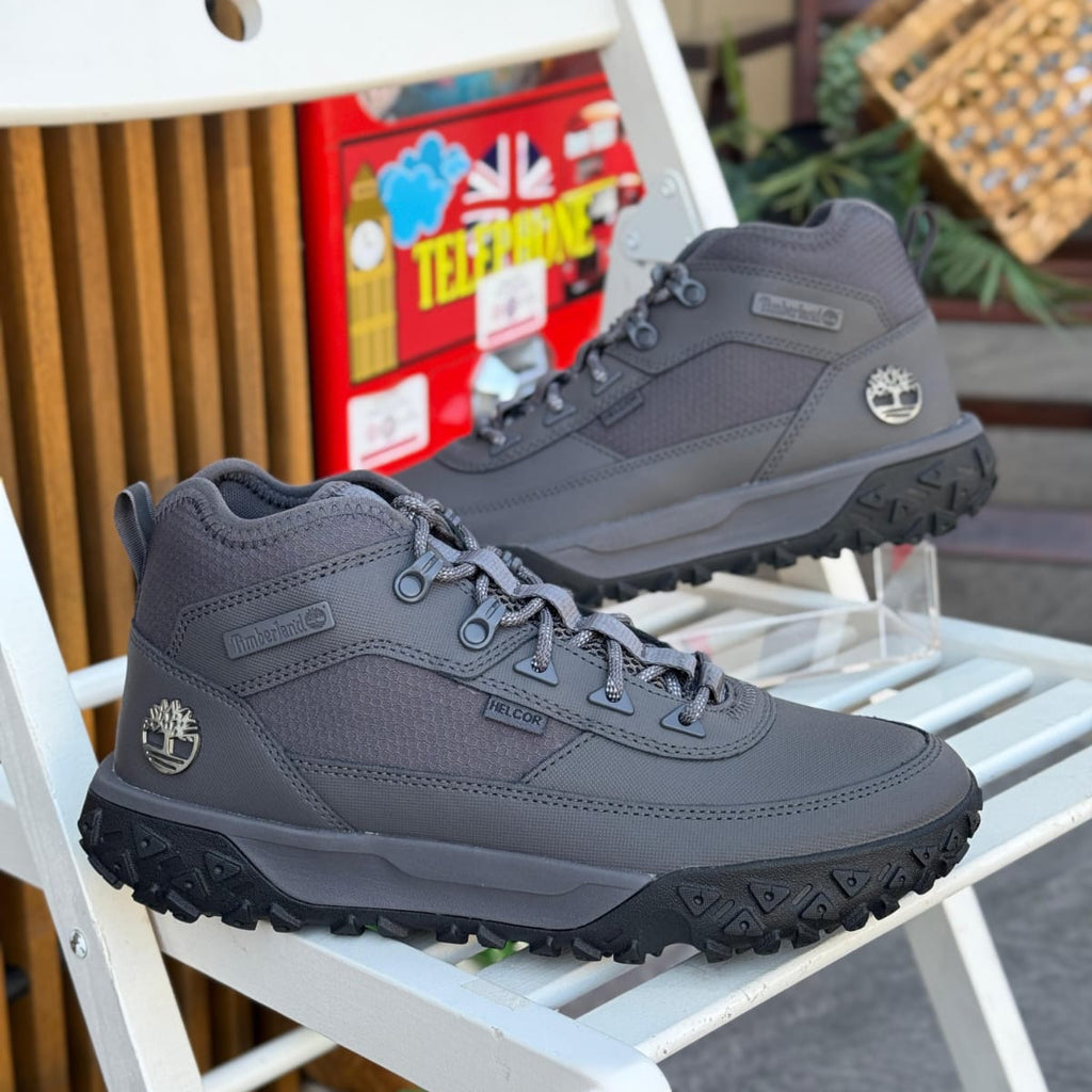 Timberland GS Motion grey men’s hiking boots outdoor on white chair background