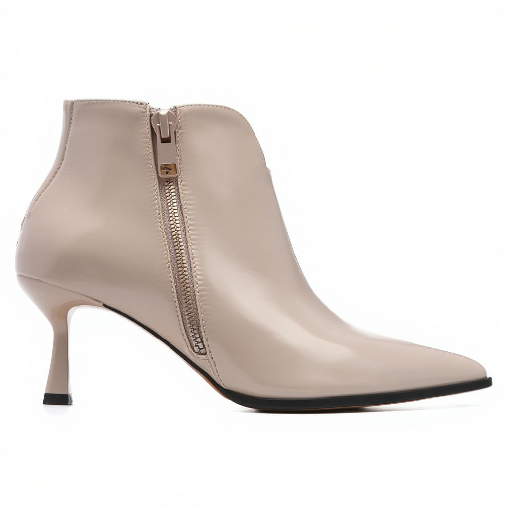 Beige ankle boot with a zipper on a white background