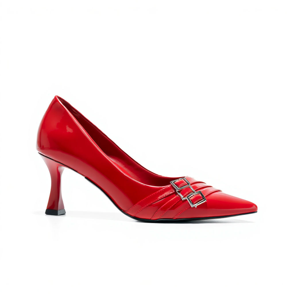 Red high-heeled shoe with a silver buckle on a white background