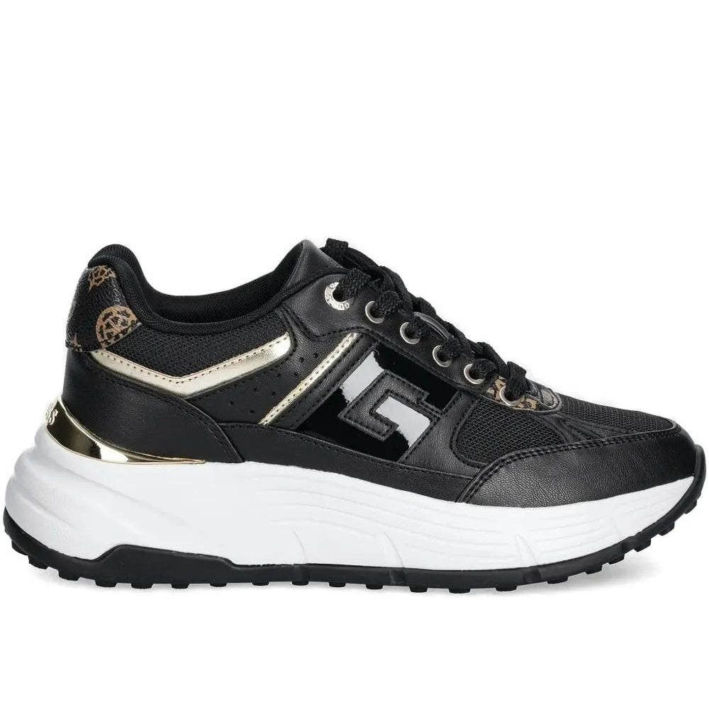 Black and white sneaker with gold accents on a white background